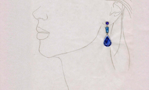 a drawing of a woman's face with a blue earring