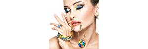 a woman with colorful makeup and jewelry on her face