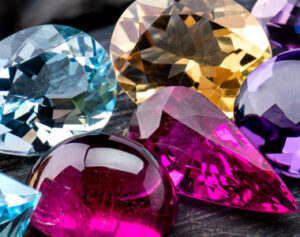 several different colored diamonds on a table