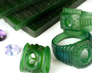 some green rings and other items on a table