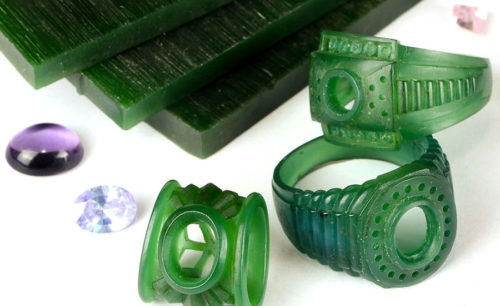 green rings and other items on a white surface