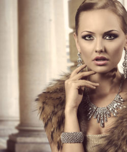 a woman in a fur coat and jewelry