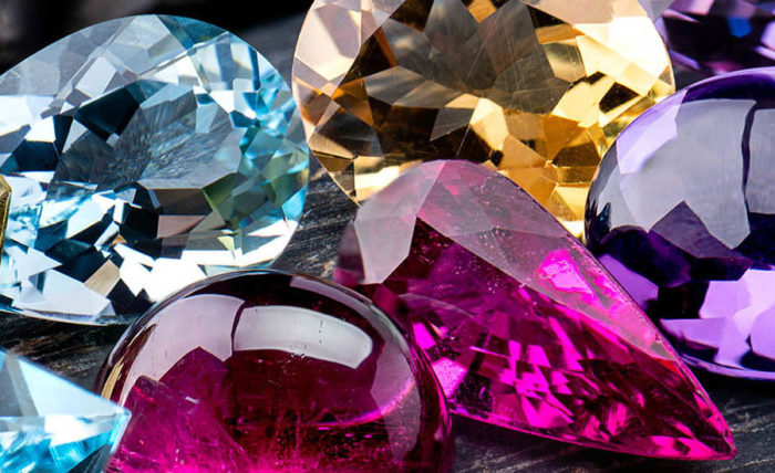 many different colored diamonds on a table
