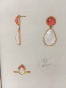 three different types of earrings on display in a box